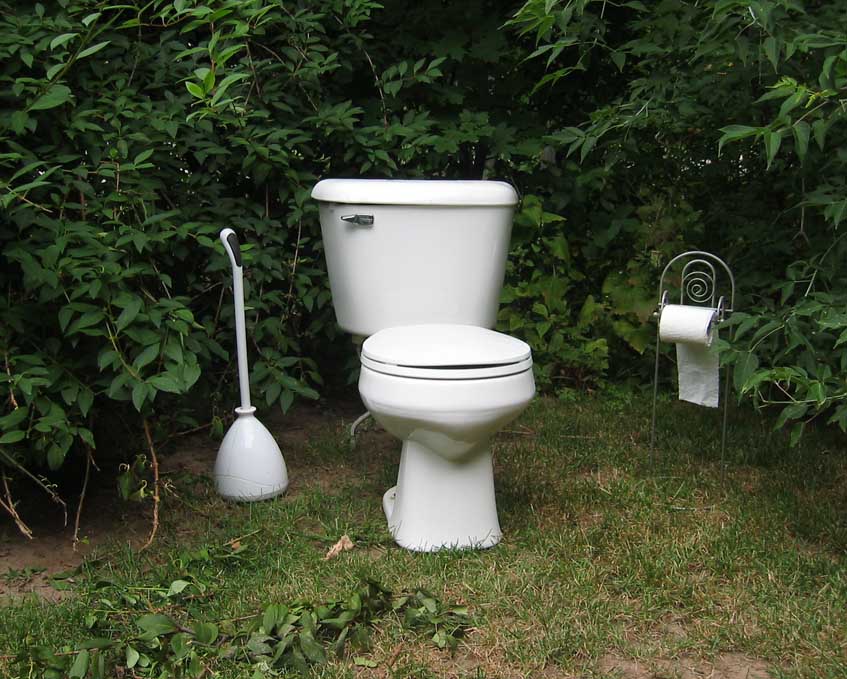 A bathroom set up in the woods